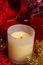 Christmas aroma candle around  red decorations. Christmas holiday concept Royalty Free Stock Photo