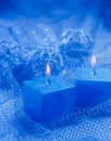 Christmas Ornaments. Two blue candles. Royalty Free Stock Photo