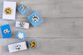 Christmas arrangement of white and blue gift boxes with beautiful bows. Copy space. Royalty Free Stock Photo