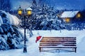 Christmas art card. Santa hat on a bench in the snow against the background of the Christmas winter forest. Village house in the b