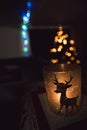 Christmas atmosphere. Candles in front of a tree.