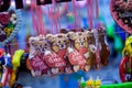 Christmas atmosphere of the city at night. Christmas sweets. Gingerbread-bears. Gingerbread-heart. Caramel rolls.. Christmas Fair