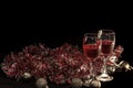 Christmas atmosphere,two red wine glass against christmas lights decoration background Royalty Free Stock Photo