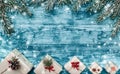 Christmas azure background with handmade gifts and fir branches at the top of the picture. Space for text