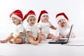 Christmas babies with laptop