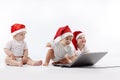 Christmas babies with laptop