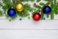 Christmas back ground green fir branches red and blue yellow ball white boards