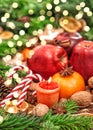 Christmas backdround Fruits spices andles golden lights Royalty Free Stock Photo