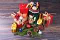 Christmas background. Advent calendar and Santa`s shoe with gifts on rustic wooden table.