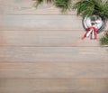 Christmas background. Antique wooden table, pine branch and vintage items. Silver tray, fork and spoon, tied with a pink bow. Royalty Free Stock Photo