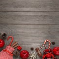Christmas background with apples, cinnamon sticks, cones and holiday decor on old wooden background, square framing Royalty Free Stock Photo