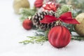 Christmas background with balls, baubles and green fir branches, pine cones, on white snow background. Winter holidays. Christmas Royalty Free Stock Photo