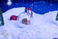 Christmas background with Christmas balls on snow over fir-tree, night sky and moon. Shallow depth of field. Christmas Royalty Free Stock Photo