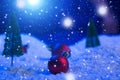 Christmas background with Christmas balls on snow over fir-tree, night sky and moon. Shallow depth of field. Christmas Royalty Free Stock Photo