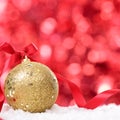 Christmas background with bauble and ribbon on the snow square Royalty Free Stock Photo