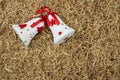 Christmas background, bells and wood shavings Royalty Free Stock Photo