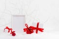 Christmas background with blank poster mockup for presentation, display with festive gift boxes, red balls with red satin ribbons. Royalty Free Stock Photo