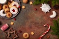 Christmas background with blank space for text, variety of Christmas cookies, milk and xmas decorations
