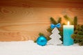 Advent candle and wood fir tree . Christmas background. Royalty Free Stock Photo