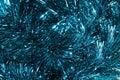 Christmas background. Blue tinsel Christmas decoration seamless