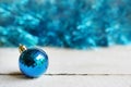 Christmas background with blue toy ball. Merry christmas greeting card. Winter holiday theme. Happy New Year. Space for text Royalty Free Stock Photo