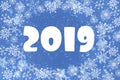 Christmas background is blue with white snowflakes. numbers 2019, greeting card Royalty Free Stock Photo