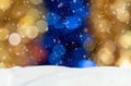 Christmas background with blue, yellow and white bokeh, snowdrift and falling snow Royalty Free Stock Photo