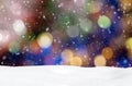 Christmas background with blue, yellow and white bokeh, snowdrift and falling snow Royalty Free Stock Photo