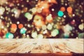 Christmas background and blurred light bokeh with empty wooden deck table Royalty Free Stock Photo