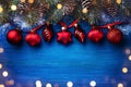 Christmas background with bokeh effect. Fir branch and Christmas tree ornaments top view. Happy New Year card Royalty Free Stock Photo