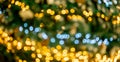 Christmas background bokeh. Christmas tree bokeh light in green yellow golden color, holiday abstract background, blur defocused Royalty Free Stock Photo