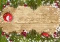 Christmas background with a border of fir branches, ball&holly Royalty Free Stock Photo