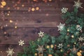 Christmas background with border of fluffy green fir branches on a textured dark brown board Royalty Free Stock Photo