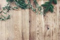 Christmas background. Border, frame of green fir, eucalyptus and pine tree branches on old wooden oak table. Winter