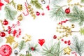 Christmas background border. Green fir branch, red holly berries, golden stars and baubles isolated on white background Royalty Free Stock Photo