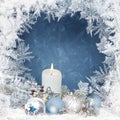 Christmas background with candles, pine branches, balls on a blue background with a frosty pattern