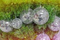 Christmas background celebrate decorated pine Christmas tree with mirror sparkle ball above green leaf background Royalty Free Stock Photo