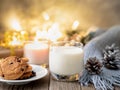 Christmas background with chocolate chip cookies, glass of milk