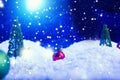 Christmas background with Christmas balls on snow over fir-tree, night sky and moon. Shallow depth of field. Christmas background Royalty Free Stock Photo