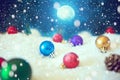 Christmas background with Christmas balls on snow over fir-tree, night sky and moon. Shallow depth of field. The elements of this Royalty Free Stock Photo