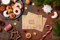 Christmas cookies and milk for Santa: linzer cookies, crescents, almond cookies, chocolate cookies. A letter for Santa Royalty Free Stock Photo