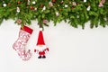 Christmas background. Christmas fir tree branch with Santa and deer on white wooden background. Copy space Royalty Free Stock Photo