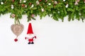 Christmas background. Christmas fir tree branch with Santa on white wooden background. Copy space Royalty Free Stock Photo
