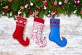Christmas background. Christmas fir tree with Christmas socks on white wooden board background Royalty Free Stock Photo
