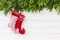 Christmas background. Christmas fir tree with Christmas socks on white wooden board background with copy space Royalty Free Stock Photo