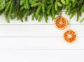 Christmas background. Christmas fir tree with orange decoration on white wooden board background, copy space Royalty Free Stock Photo