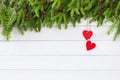 Christmas background. Christmas fir tree with red hearts decoration on white wooden board background Royalty Free Stock Photo