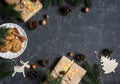 Christmas background. Christmas gifts, decorations, cookies, christmas tree. On a dark background, top view. Free space for text. Royalty Free Stock Photo