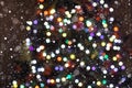 Christmas Background. Colorful Holiday Abstract Glitter Defocused Background With Blinking Stars an snowfalls. Blurred Bokeh Royalty Free Stock Photo