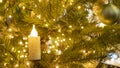 Christmas Background. Composition with fir branches, electric burning candle and christmas ball